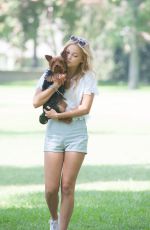 OLIVIA HOLT Walks Her Dog at a Park in Los Amgeles