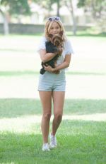 OLIVIA HOLT Walks Her Dog at a Park in Los Amgeles