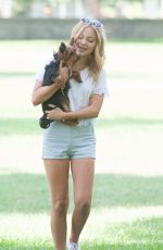 OLIVIA HOLT Walks Her Dog at a Park in Los Amgeles