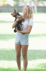 OLIVIA HOLT Walks Her Dog at a Park in Los Amgeles