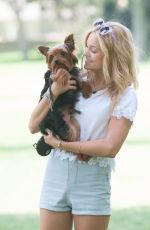 OLIVIA HOLT Walks Her Dog at a Park in Los Amgeles