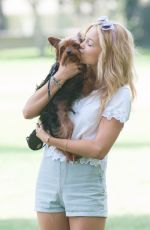 OLIVIA HOLT Walks Her Dog at a Park in Los Amgeles