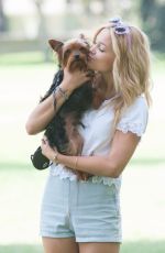 OLIVIA HOLT Walks Her Dog at a Park in Los Amgeles