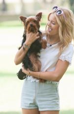 OLIVIA HOLT Walks Her Dog at a Park in Los Amgeles