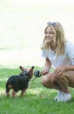 OLIVIA HOLT Walks Her Dog at a Park in Los Amgeles