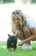 OLIVIA HOLT Walks Her Dog at a Park in Los Amgeles