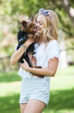 OLIVIA HOLT Walks Her Dog at a Park in Los Amgeles