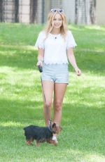OLIVIA HOLT Walks Her Dog at a Park in Los Amgeles