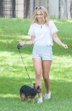 OLIVIA HOLT Walks Her Dog at a Park in Los Amgeles