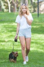 OLIVIA HOLT Walks Her Dog at a Park in Los Amgeles