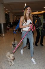 BELLA THORNE in Jeans Arrives at LAX Airport