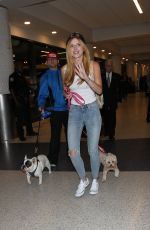 BELLA THORNE in Jeans Arrives at LAX Airport