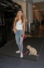 BELLA THORNE in Jeans Arrives at LAX Airport