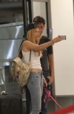 BELLA THORNE in Jeans Arrives at LAX Airport