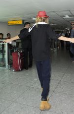 CARA DELEVINGNE at Heathrow Airport in London 0209