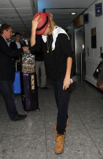 CARA DELEVINGNE at Heathrow Airport in London 0209