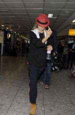 CARA DELEVINGNE at Heathrow Airport in London 0209