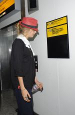 CARA DELEVINGNE at Heathrow Airport in London 0209