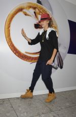 CARA DELEVINGNE at Heathrow Airport in London 0209