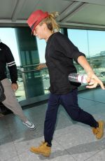CARA DELEVINGNE at Heathrow Airport in London 0209