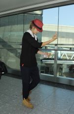 CARA DELEVINGNE at Heathrow Airport in London 0209