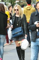 DAKOTA FANNING in Knee Boots Out in New York