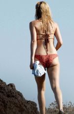 DAKOTA JOHNSON in Bikini at a Beach in Sicily