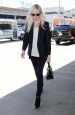 KIRSTEN DUNST Arrives at Los Angeles International Airport