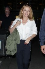 KYLIE MINOGUE at hHeathrow Airport in London 0209