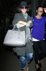 LILY COLLINS ar Los Angeles International Airport 2309