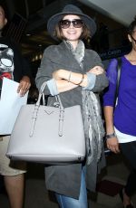 LILY COLLINS ar Los Angeles International Airport 2309