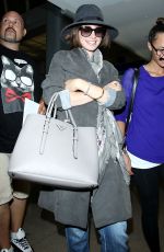 LILY COLLINS ar Los Angeles International Airport 2309