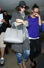 LILY COLLINS ar Los Angeles International Airport 2309