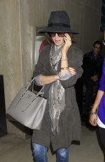 LILY COLLINS ar Los Angeles International Airport 2309