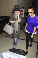 LILY COLLINS ar Los Angeles International Airport 2309