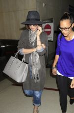 LILY COLLINS ar Los Angeles International Airport 2309