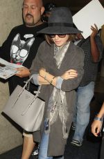 LILY COLLINS ar Los Angeles International Airport 2309