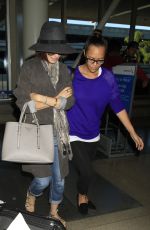 LILY COLLINS ar Los Angeles International Airport 2309