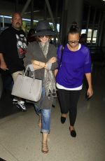 LILY COLLINS ar Los Angeles International Airport 2309
