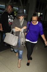 LILY COLLINS ar Los Angeles International Airport 2309