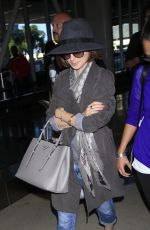LILY COLLINS ar Los Angeles International Airport 2309