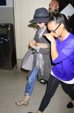 LILY COLLINS ar Los Angeles International Airport 2309