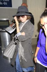 LILY COLLINS ar Los Angeles International Airport 2309