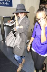 LILY COLLINS ar Los Angeles International Airport 2309