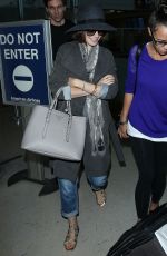 LILY COLLINS ar Los Angeles International Airport 2309