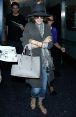 LILY COLLINS ar Los Angeles International Airport 2309