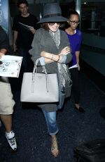 LILY COLLINS ar Los Angeles International Airport 2309