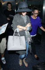 LILY COLLINS ar Los Angeles International Airport 2309