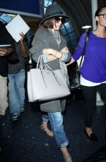 LILY COLLINS ar Los Angeles International Airport 2309