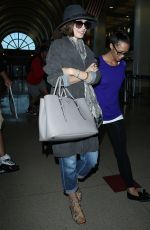 LILY COLLINS ar Los Angeles International Airport 2309